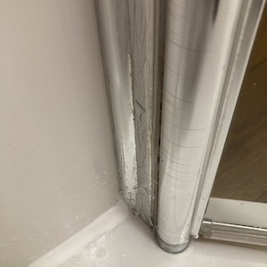 Bathroom Revival before & after photo of mould removal with new antifungal silicone sealant. 